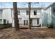 An exterior view of the back of the home shows a wooden deck and white siding at 780 Gardenside Se Cir, Marietta, GA 30067