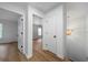 Upstairs hallway with hard wood floors and modern light fixtures at 780 Gardenside Se Cir, Marietta, GA 30067