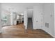 Inviting living area with hardwood floors, leading to the kitchen and staircase at 780 Gardenside Se Cir, Marietta, GA 30067