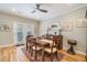 Bright dining room with hardwood floors, a ceiling fan, and french doors leading to the back at 8 Kings Walk Ne, Atlanta, GA 30307