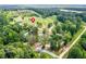 This home offers a serene setting with mature trees and a pond, all easily accessible via winding roads at 878 Forrester Cemetery Rd, Covington, GA 30014