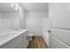 Bathroom featuring double vanity, quartz countertops, framed mirrors, and modern fixtures at 878 Forrester Cemetery Rd, Covington, GA 30014