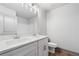 Bathroom featuring double vanity, quartz countertops, framed mirrors, and modern fixtures at 878 Forrester Cemetery Rd, Covington, GA 30014