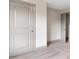 Neutral-toned bedroom with gray trim, light carpet, and doorways at 878 Forrester Cemetery Rd, Covington, GA 30014