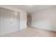 Cozy bedroom featuring double doors for closet space, plush carpet, and neutral walls at 878 Forrester Cemetery Rd, Covington, GA 30014