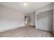 Bedroom with neutral walls, hardwood floors, and closet at 878 Forrester Cemetery Rd, Covington, GA 30014