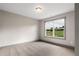 Bedroom featuring a large window with views of the green landscape at 878 Forrester Cemetery Rd, Covington, GA 30014