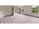Spacious bedroom featuring neutral walls, carpet, and natural light at 878 Forrester Cemetery Rd, Covington, GA 30014