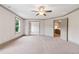 Bonus room with large doorways, large windows and neutral carpeting at 878 Forrester Cemetery Rd, Covington, GA 30014
