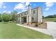 A charming two-story home features a covered porch, manicured lawn, and a private driveway at 878 Forrester Cemetery Rd, Covington, GA 30014