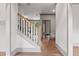 Foyer with hardwood floors, staircase, and neutral colors with gray trim at 878 Forrester Cemetery Rd, Covington, GA 30014