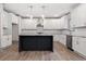 Well-equipped kitchen with stainless steel appliances, island, and white cabinetry at 878 Forrester Cemetery Rd, Covington, GA 30014
