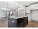 Beautiful kitchen with stainless steel appliances, island, and easy access to living room at 878 Forrester Cemetery Rd, Covington, GA 30014