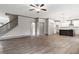 Open living area featuring hardwood floors and staircase leading to the second floor at 878 Forrester Cemetery Rd, Covington, GA 30014