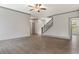 Spacious living room with hardwood floors and easy access to staircase and hallways at 878 Forrester Cemetery Rd, Covington, GA 30014