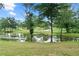 A serene pond is nestled among mature trees, offering a peaceful natural view at 878 Forrester Cemetery Rd, Covington, GA 30014
