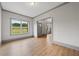 Room with hardwood floors and natural light with green view outside the window at 878 Forrester Cemetery Rd, Covington, GA 30014