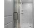 Contemporary shower boasts sleek glass door and marble-style tile surround at 878 Forrester Cemetery Rd, Covington, GA 30014