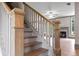 Hardwood staircase featuring natural wood steps and white risers, leading to a living space at 878 Forrester Cemetery Rd, Covington, GA 30014