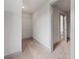 Walk-in closet with built-in shelving, neutral carpet, and natural light at 878 Forrester Cemetery Rd, Covington, GA 30014