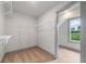Walk-in closet with built-in shelving, neutral carpet, and natural light at 878 Forrester Cemetery Rd, Covington, GA 30014