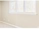 Light-filled bedroom with neutral walls and carpet at 1807 Ashborough Cir # G, Marietta, GA 30067