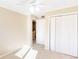 Bedroom featuring neutral carpet and walls, with a closet and doorway at 1807 Ashborough Cir # G, Marietta, GA 30067