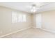 Spacious bedroom featuring neutral walls, ceiling fan, and plush carpeting at 1807 Ashborough Cir # G, Marietta, GA 30067