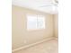 Bright bedroom with a window, neutral walls, carpet, and white trim at 1807 Ashborough Cir # G, Marietta, GA 30067