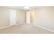 Neutral bedroom with plush carpeting, closet and doorway at 1807 Ashborough Cir # G, Marietta, GA 30067