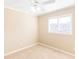 Neutral bedroom features a ceiling fan, a double window, and neutral carpet at 1807 Ashborough Cir # G, Marietta, GA 30067