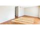 A bright, open-concept living room with hardwood floors and neutral paint at 1807 Ashborough Cir # G, Marietta, GA 30067