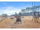 Wood chip playground with swings, slides and picnic tables for residents at 1807 Ashborough Cir # G, Marietta, GA 30067
