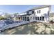 A beautiful backyard with a pool and a large white house in the background on a sunny day at 2427 Wolf Meadow Ln, Buford, GA 30518