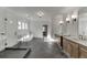 Bright bathroom with glass shower, dual vanities, and large tiled floors at 2427 Wolf Meadow Ln, Buford, GA 30518