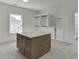 A spacious closet with an island and custom shelving at 2427 Wolf Meadow Ln, Buford, GA 30518
