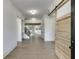 Inviting foyer with hardwood floors, complemented by a view of an elegant staircase and bright, open living spaces at 2427 Wolf Meadow Ln, Buford, GA 30518