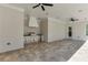 Covered outdoor kitchen featuring stainless steel appliances and a tile floor offers the perfect space for entertaining at 2427 Wolf Meadow Ln, Buford, GA 30518