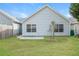 Backyard features a spacious lawn and a small concrete patio at 621 Shadow Lake Dr, Lithonia, GA 30058