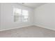Bedroom with neutral paint, plush carpet, and natural light at 621 Shadow Lake Dr, Lithonia, GA 30058
