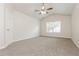 Spacious bedroom with a ceiling fan and a window bringing in natural light at 621 Shadow Lake Dr, Lithonia, GA 30058