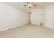 Large bedroom with a ceiling fan and a doorway that provides access to the bathroom at 621 Shadow Lake Dr, Lithonia, GA 30058