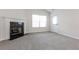 Bright living room featuring a fireplace, neutral paint, and plush carpet at 621 Shadow Lake Dr, Lithonia, GA 30058