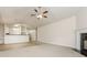 Open-concept living room with fireplace, carpet, tile, and vaulted ceiling at 621 Shadow Lake Dr, Lithonia, GA 30058