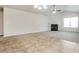 Spacious living room featuring a fireplace, vaulted ceiling, and a large window at 621 Shadow Lake Dr, Lithonia, GA 30058