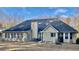 Back exterior showcasing a spacious backyard with patio, ideal for entertaining at 1959 Firelight Ln, Buford, GA 30519