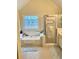 Bright bathroom features a soaking tub, decorative window, and separate shower at 1959 Firelight Ln, Buford, GA 30519