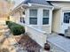 Charming home exterior with pristine windows, well-maintained landscaping, and cozy porch at 1959 Firelight Ln, Buford, GA 30519