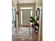 Inviting foyer with tile flooring, decorative rug, and traditional accents at 1959 Firelight Ln, Buford, GA 30519