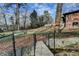 Scenic backyard featuring a bridge over a creek, a fire pit and fenced yard at 3542 Briarcliff Ne Rd, Atlanta, GA 30345